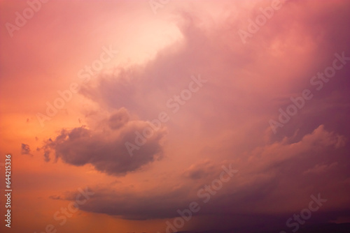 Photo of rainy clouds and pink sky.