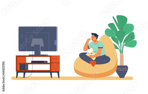 Teenage boy watching TV at home flat vector illustration. Boy sitting on the bean bag chair eating pop corn.