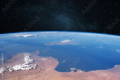 Blue amazing planet earth with ocean and continents in open space in the starry space.