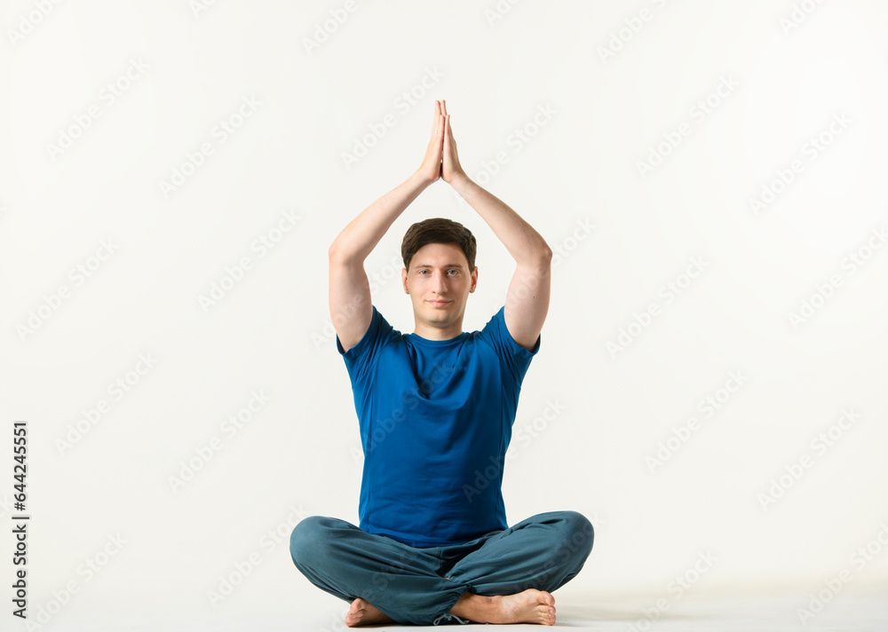 yoga practice on white background.man performs yoga exercises