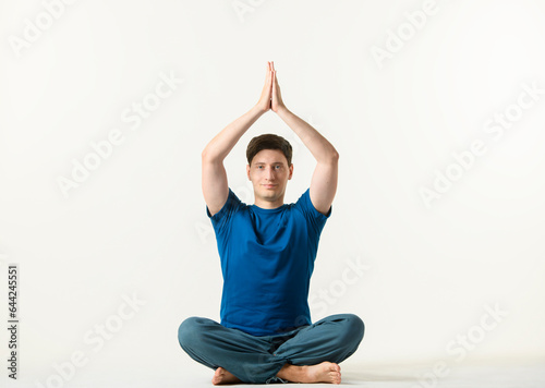 yoga practice on white background.man performs yoga exercises