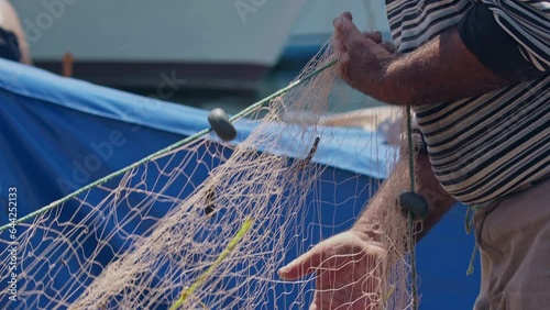 Fishermen at Work Cleaning Fishing Nets Footage.