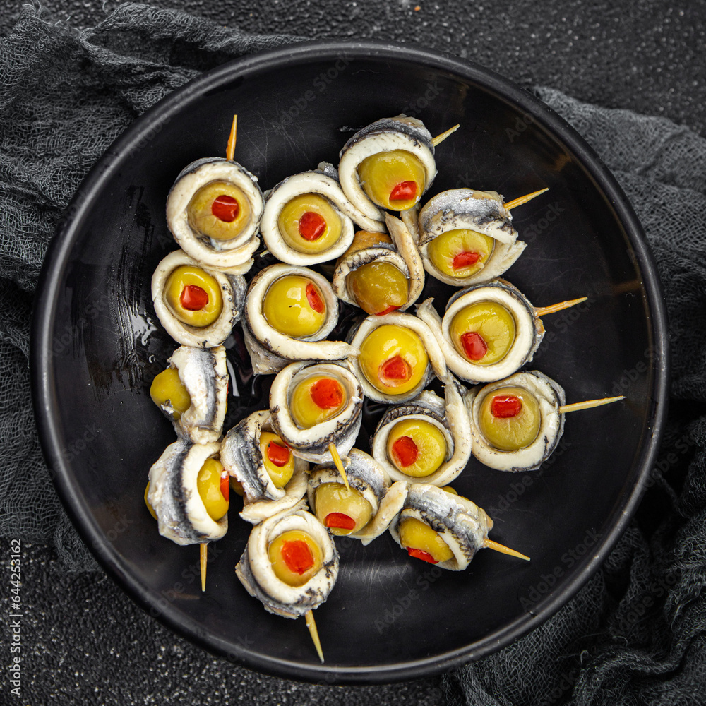 olive stuffed anchovy fillet, anchovys roll stuffed olives apetizing seafood fish marinated