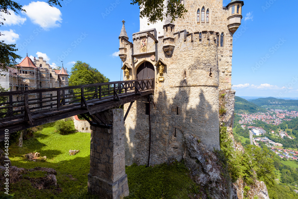 Obraz premium Lichtenstein Castle with vintage bridge at mountain top, Germany, Europe