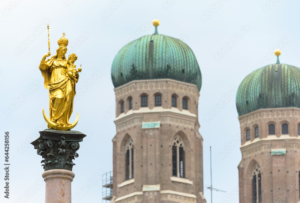 Virgin Mary statue on sky background at Marienplatz, Munich, Germany