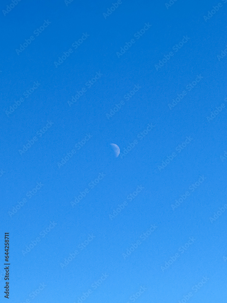Crescent Moon in the Blue Sky of Amsterdam, Netherlands Crescent Moon in the Blue Sky of Amsterdam, Netherlands