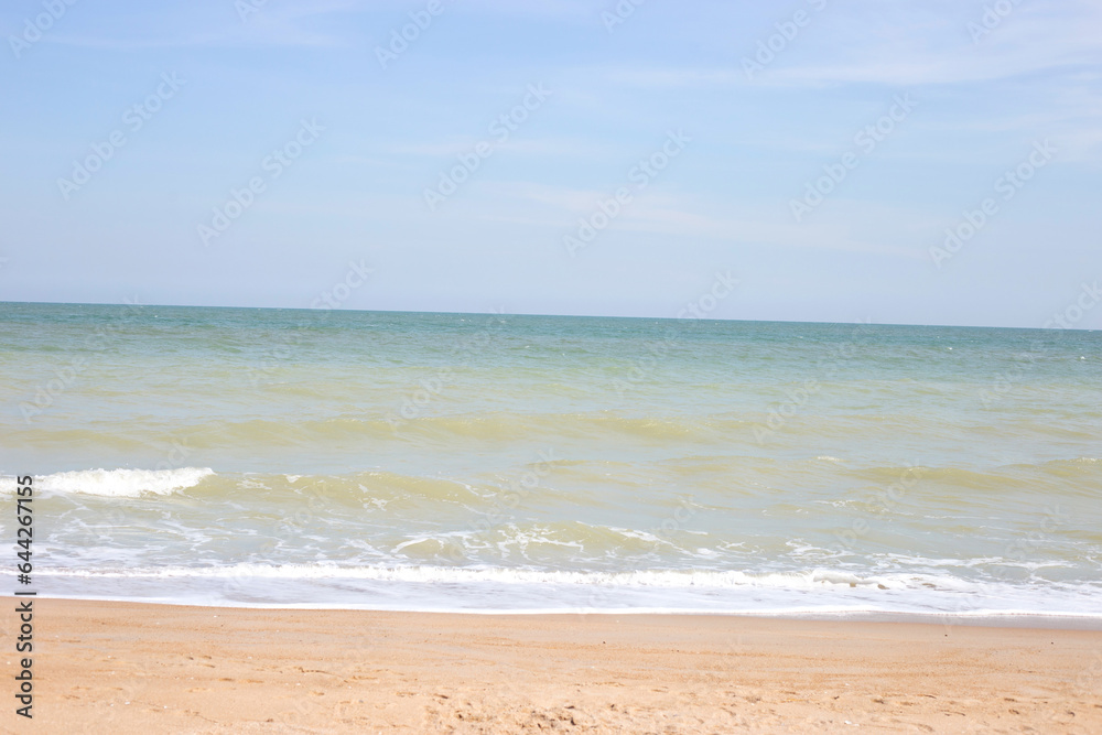 Sand beach with sea and sky. Holiday summer beach
