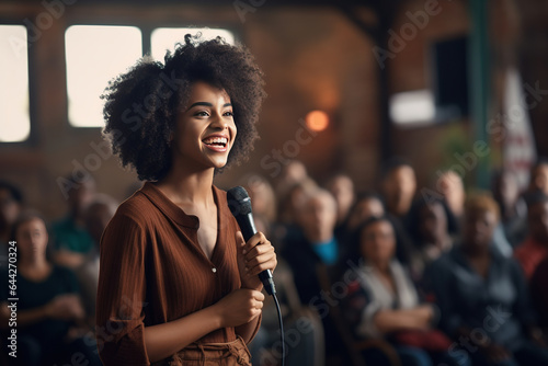 A Young African American business woman engaged in a public speaking event, filled with emotion and feelings