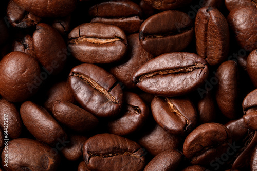 Aromatic roasted coffee beans as background  top view