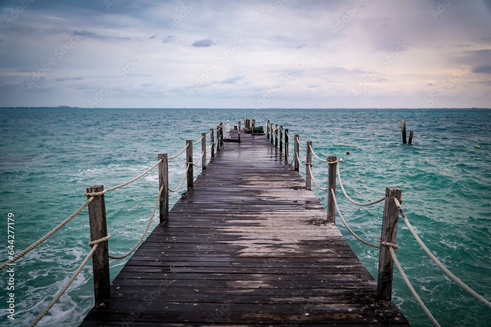 dock stretching out into the Caribbean sea