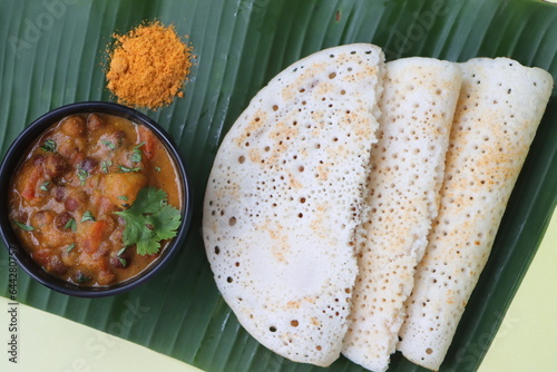 Set dosa served with black chana curry and podi, or sponge dosa, thick fluffy and soft made with rice, urad dal, fenugreek seeds and poha, south Indian food