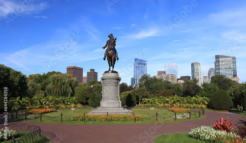 George Washington statue and Boston skyline in Public Garden  USA