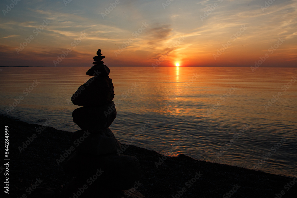 Silhouette of a Rock Cairn on the Beach at Chimney Bluffs State Park