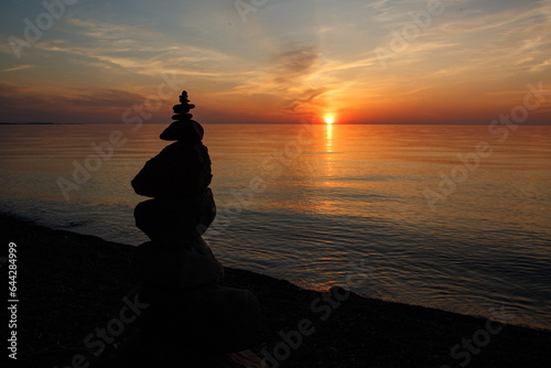 Silhouette of a Rock Cairn on the Beach at Chimney Bluffs State Park