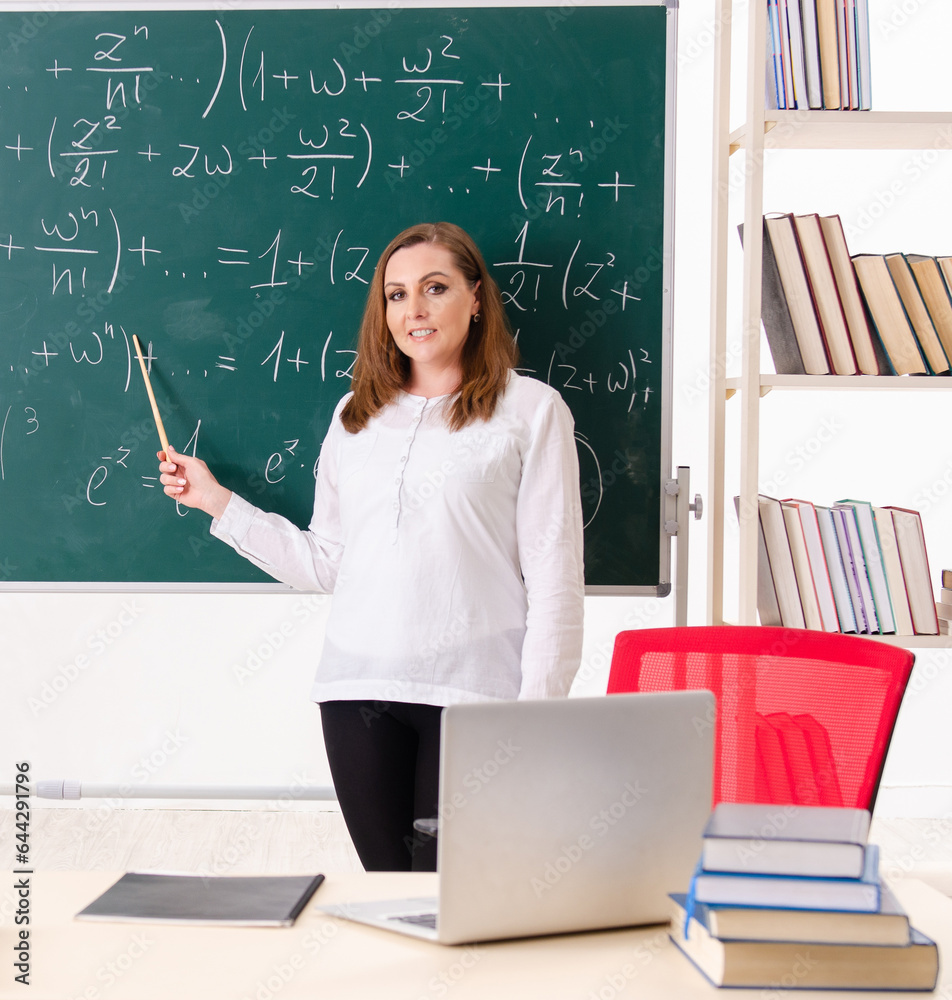 Female math teacher in the classroom Female math teacher in the classroom