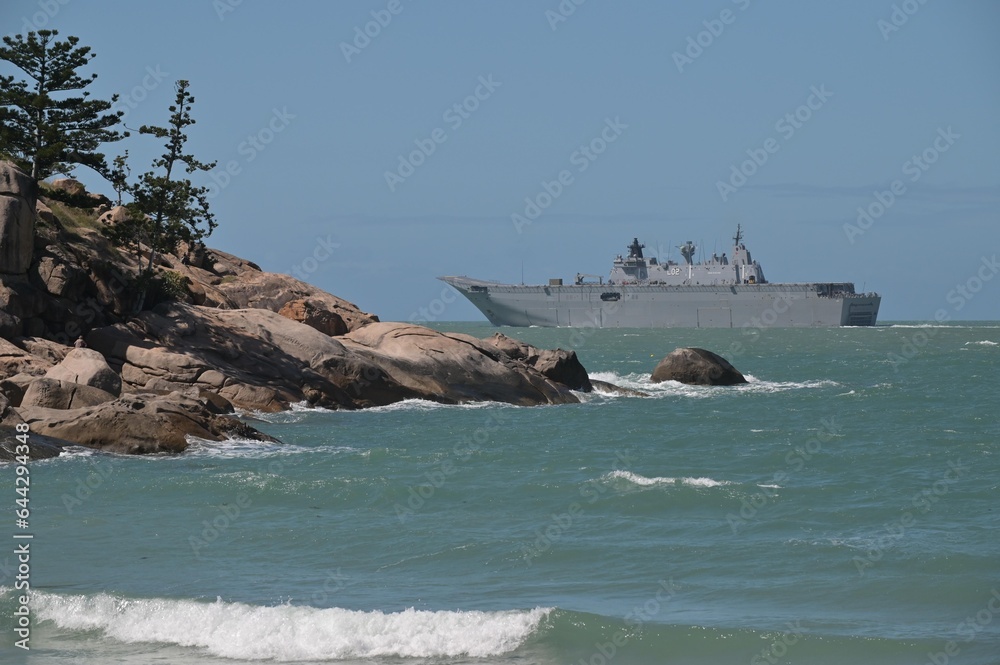 HMAS Adelaide Australian landing helicopter dock ship passing by Magnetic Island Queensland Australia