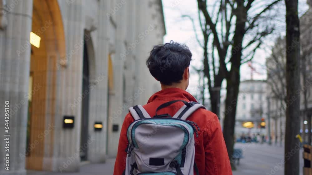 Asian attractive man backpacker walking around beautiful road in city. Asian attractive man backpacker walking around beautiful road in city.