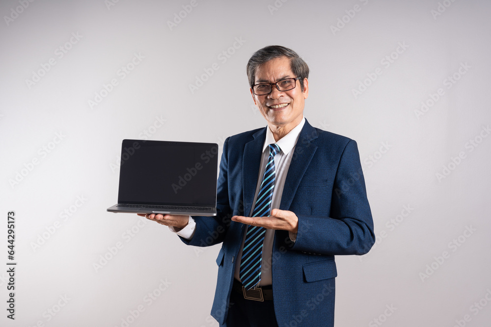 Portrait of an elderly Asian businessman, posing on a blue background Portrait of an elderly Asian businessman, posing on a blue background