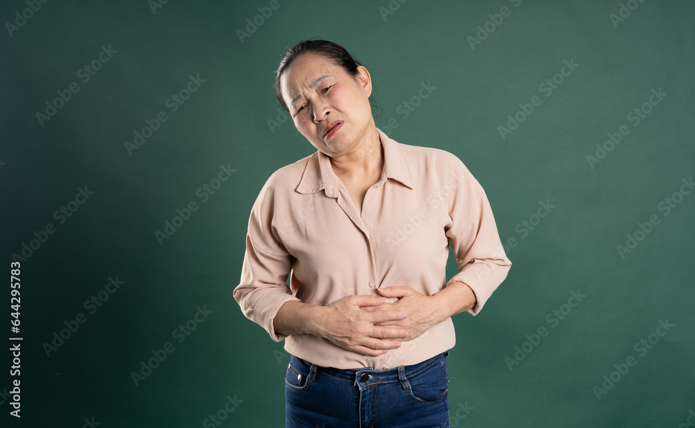 Gangang middle-aged Asian female portrait posing on blue background
