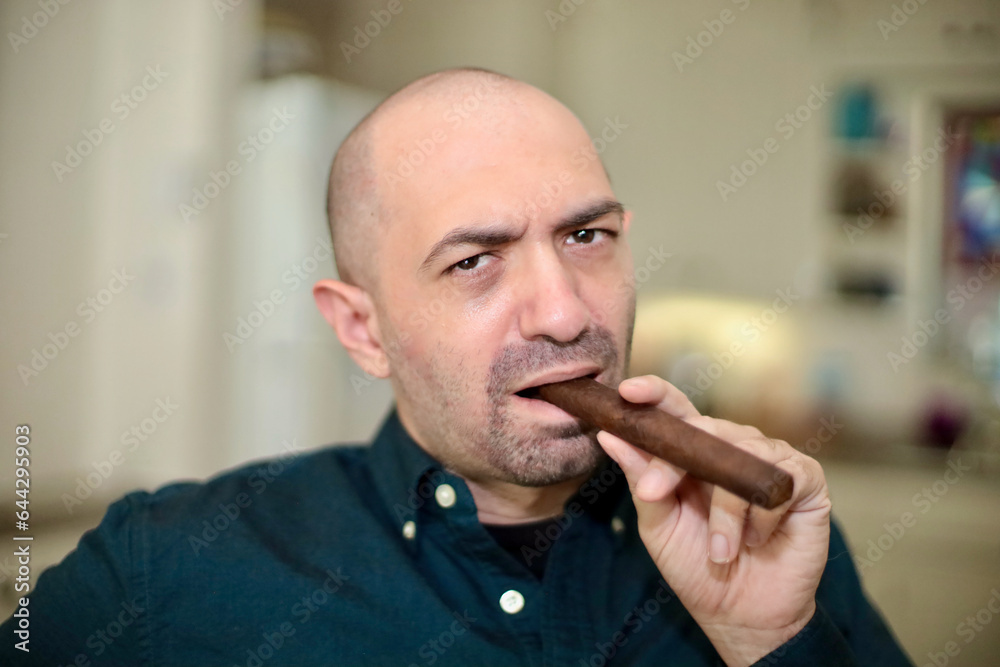man smoking cigar man smoking cigar