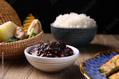 pork shrimp chilli dip local thai food sauce isolated in wood background