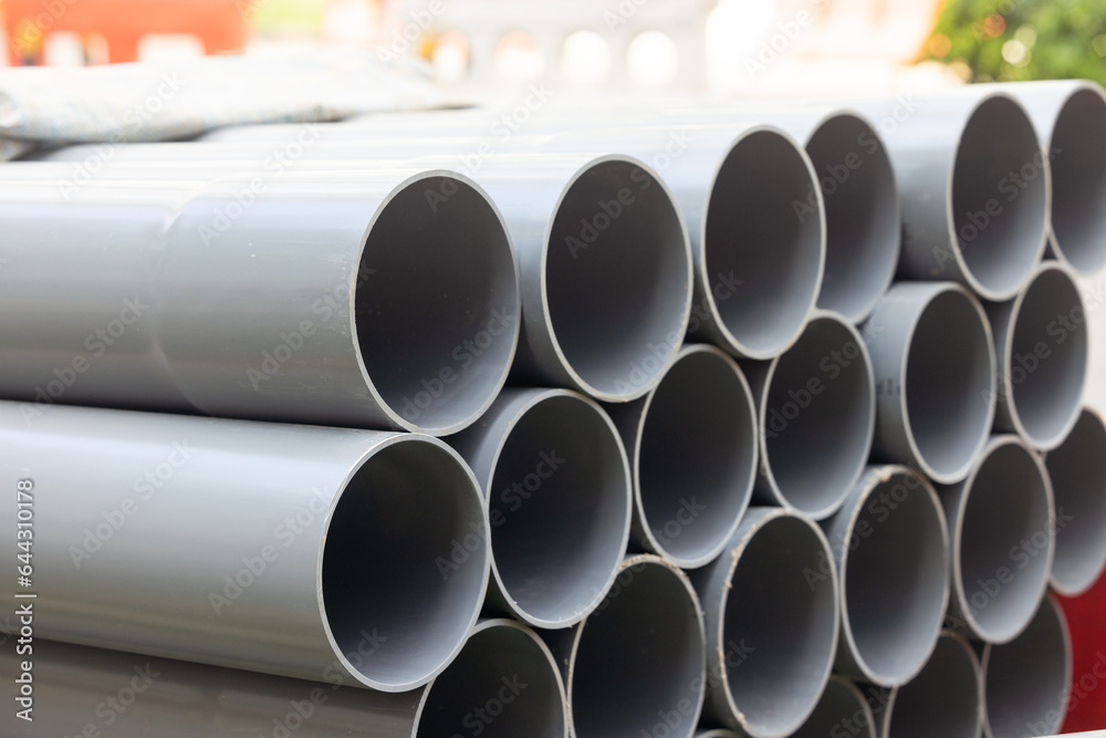 on the construction site, awaiting installation. These durable and lightweight pipes are organized neatly, with their varying sizes and lengths strategically placed next to each other. on the construction site, awaiting installation. These durable and lightweight pipes are organized neatly, with their varying sizes and lengths strategically placed next to each other.