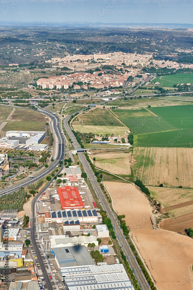 Vertical aerial image of the industrial estate of Toledo in which the national highway 400 and the train track connect with the Santa Barbara neighborhood and the old town