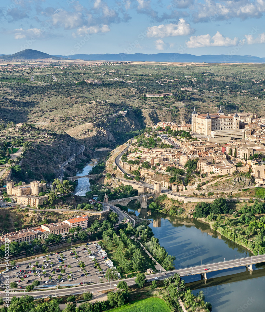 Aerial image of the eastern part of the old town of Toledo in which you can see the Alcazar, the Alcantara Bridge crossed by the Tagus River and the Castle of San Servando in detail