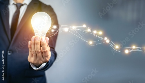 person holding light bulb on hand