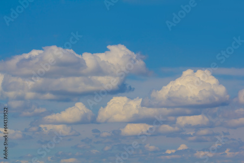 closeup huge cumulus clouds on blue sky © Yuriy Kulik