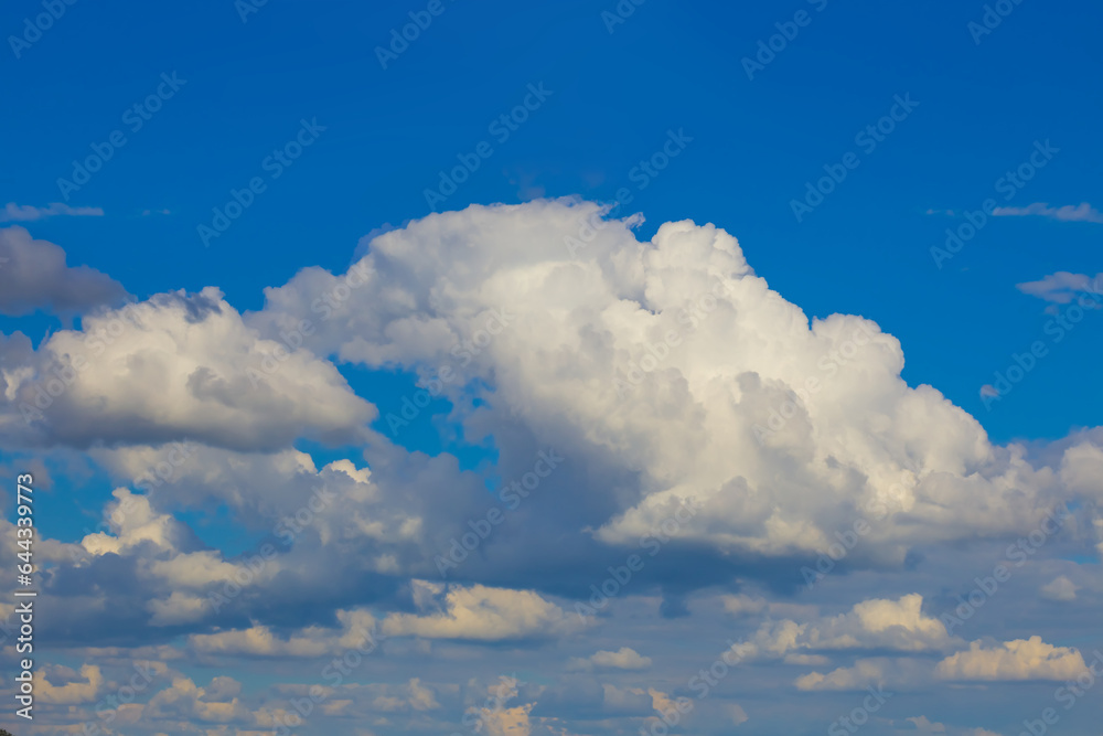 closeup huge cumulus clouds on blue sky background closeup huge cumulus clouds on blue sky background