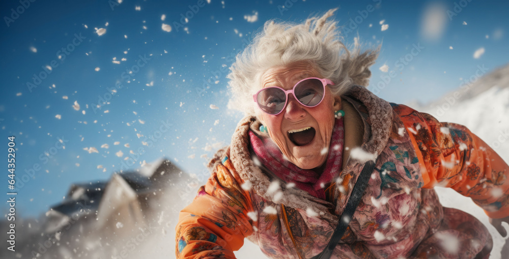 A joyous grandmother revels in a winter wonderland, sliding down a snowy slope on a sled, spreading warmth and happiness. - obrazy, fototapety, plakaty 