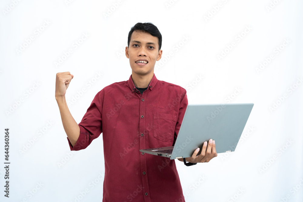 asian man, businessman or student concept wearing red casual clothes elegant pose carrying a minimalist laptop. Isolated white background. asian man, businessman or student concept wearing red casual clothes elegant pose carrying a minimalist laptop. Isolated white background.