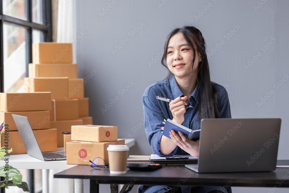 Small business aspiring young asian entrepreneur SME, small and medium business freelance worker working in a home office.SME online business ideas. Small business aspiring young asian entrepreneur SME, small and medium business freelance worker working in a home office.SME online business ideas.