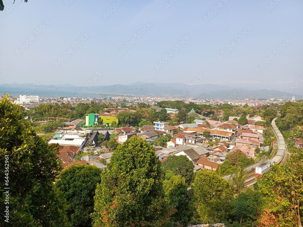 Train Makes S Shape, Trees, Houses, Mountains And Bay of Lampung in One Frame