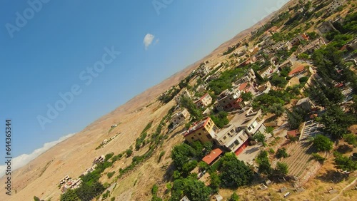 Drone Fly Over Historic Town With Rocky Mountains In Lebanon. FPV photo