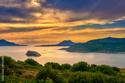 Sunset over Greek islands at Mediterranean sea, bay of Sounio, Greece.