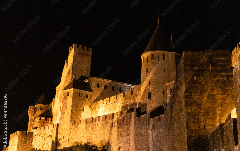 Night view of medieval castle and wall in Carcassone