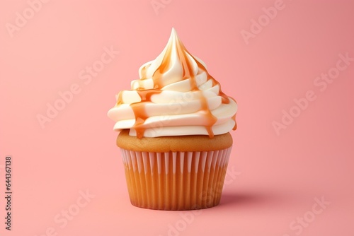 A vanilla cupcake with buttercream icing and caramel sauce on a pink background. A 3D cutout with room to write. Generative AI