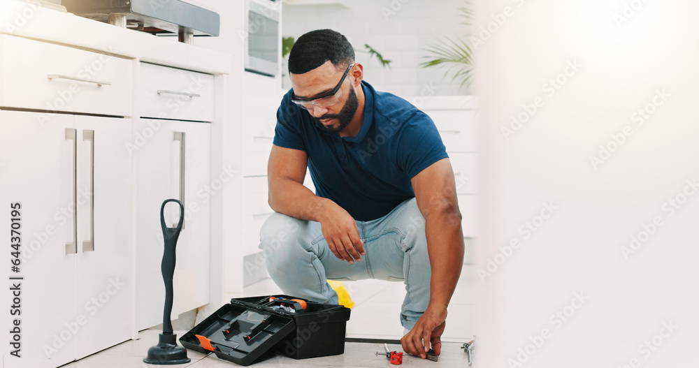Fototapeta premium Plumber man, tools and box on floor maintenance with packing, focus and pipe repair service in house. Entrepreneur handyman, plumbing expert and small business owner with toolbox in home kitchen