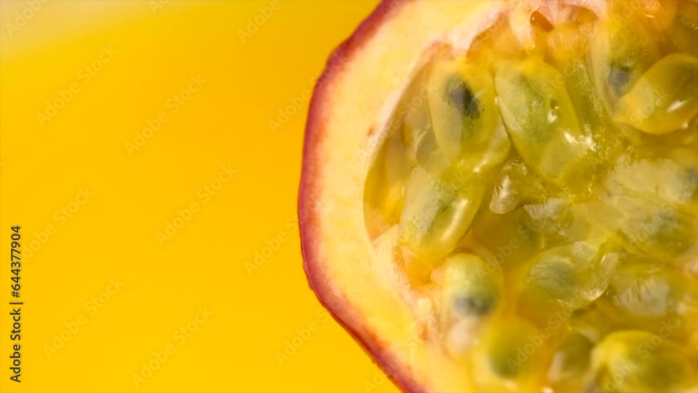 Passion fruit juicy pulp close up, splashing, Maracuya exotic fruit juicy splash. Ripe and fresh healthy vegan food and drinks, slow motion Passion fruit juicy pulp close up, splashing, Maracuya exotic fruit juicy splash. Ripe and fresh healthy vegan food and drinks, slow motion