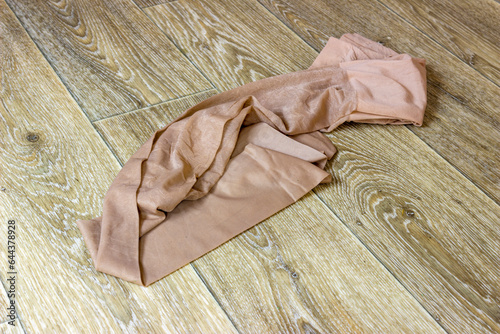 Crumpled pantyhose on floor