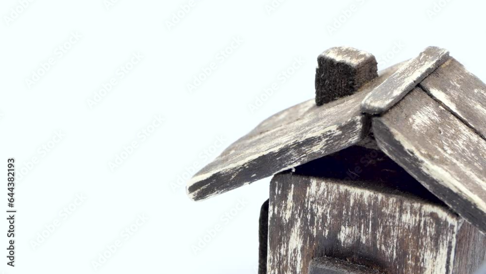 small house model on a white background. flashlight effect. 4k video capture small house model on a white background. flashlight effect. 4k video capture