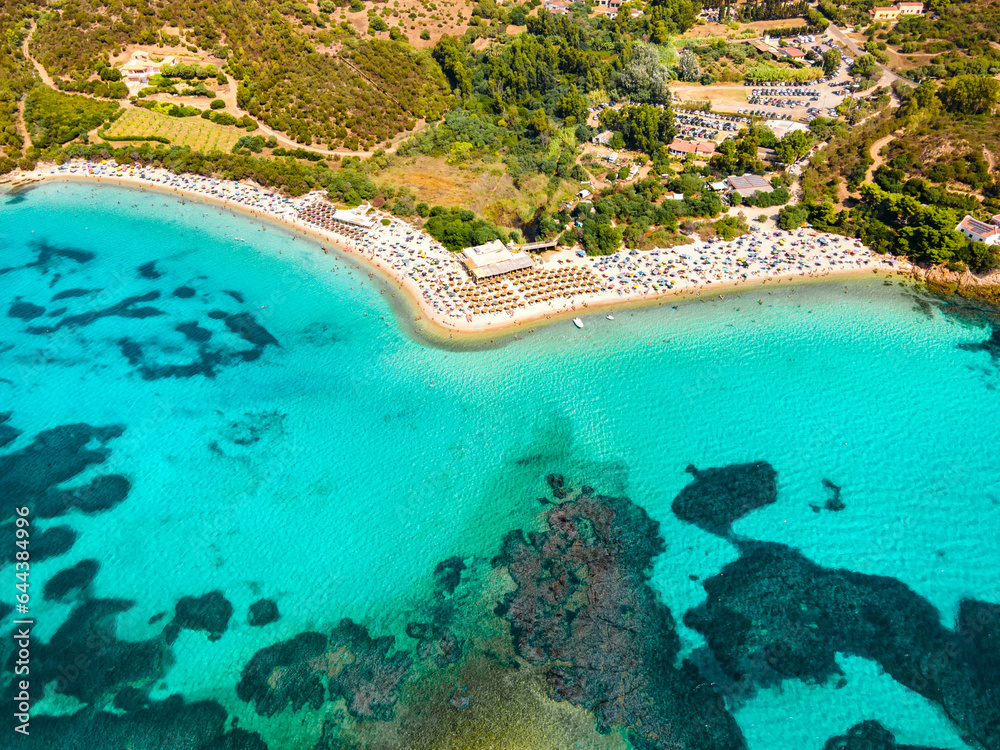 Luxury beach with perfectly clear water on the island of Sardinia in Italy. Tourist destination in Europe