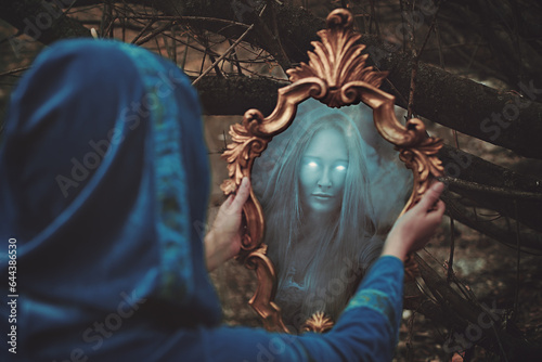 Mystical reflection of a forest witch. Mirror magic