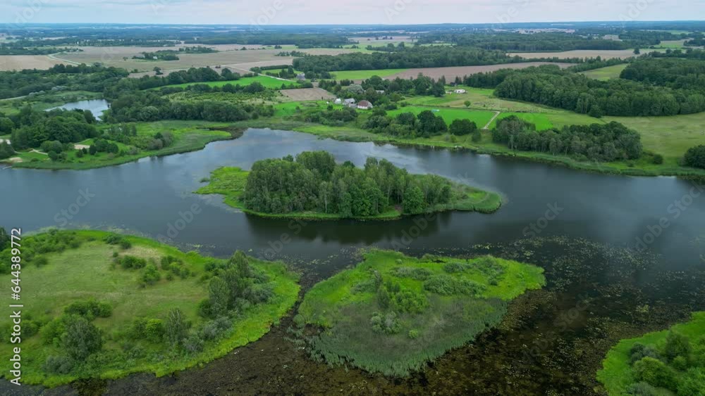 Drone view over a green water landscape with several islands.
