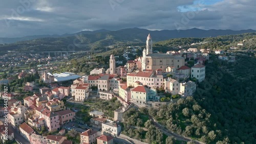 San Giovanni Battista catholic church overlooking ancient town Cervo, aerial photo