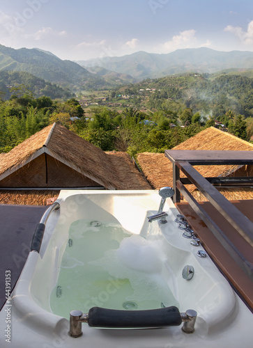 A water flows into the outdoor bathtub at the lookout. © milkovasa