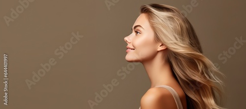 Young Woman with Long Hair Isolated on a Flat Background