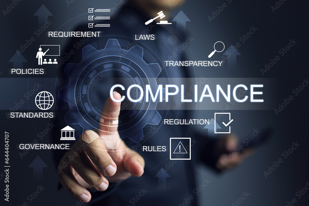 Businessman pointing on gear or cog to working with compliance driving law and regulation standards to international standard requirement certified of country procedure products import and export Businessman pointing on gear or cog to working with compliance driving law and regulation standards to international standard requirement certified of country procedure products import and export